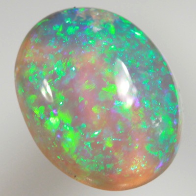 SOLID CRYSTAL OPAL Bright sparkles of greens throughout a purple hue